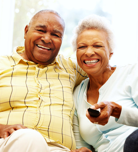two elderly couple smiling